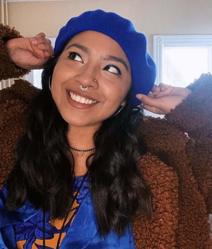 latinx woman in blue beret
